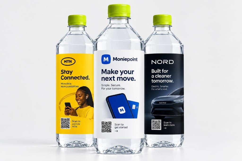 Branded Udara water bottles with sponsor labels in people's hands